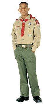A Boy Scout in full uniform, his shirt buttons, belt buckle and trouser fly lined up in a straight gig line