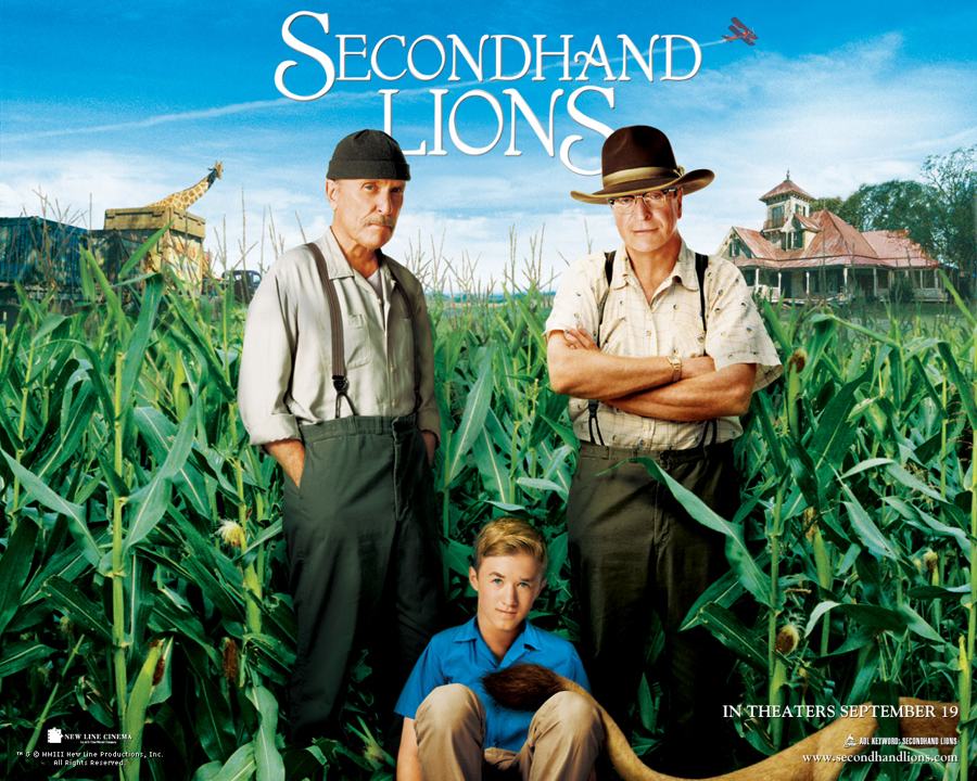 Secondhand Lions (2003) poster: Robert Duvall and Michael Caine as the two uncles in a cornfield, Haley Joel Osment as Walter, a lion and a biplane